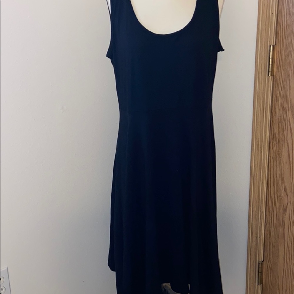 Black dress with full skirt .